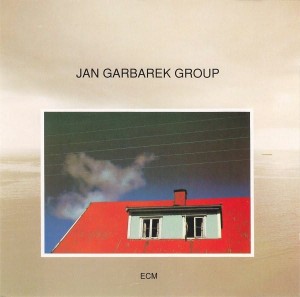 GARBAREK JAN  - PHOTO WITH WHITE CLOUD, WIRES, WINDOWS AND A RED ROOF